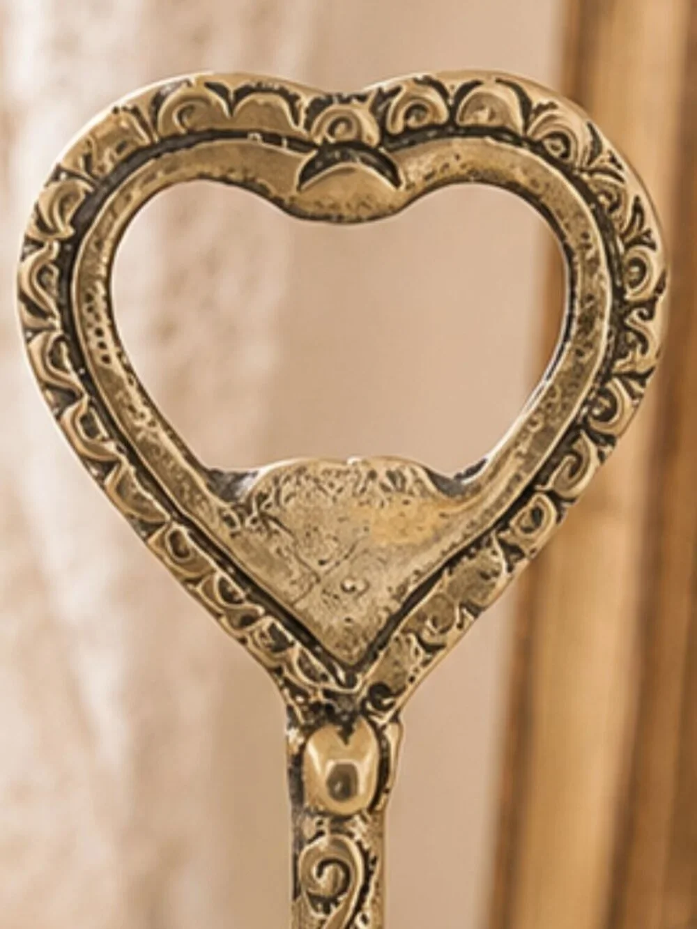 Vintage Brass Bottle Opener Bell With Embossed Details and Heart-Shaped Handle